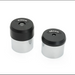 Two cylindrical lens accessories with black tops and silver bodies on a white background.