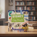 Book titled 'Sydney City Trails' by Lonely Planet Kids on a table with a blurred bookshelf background.