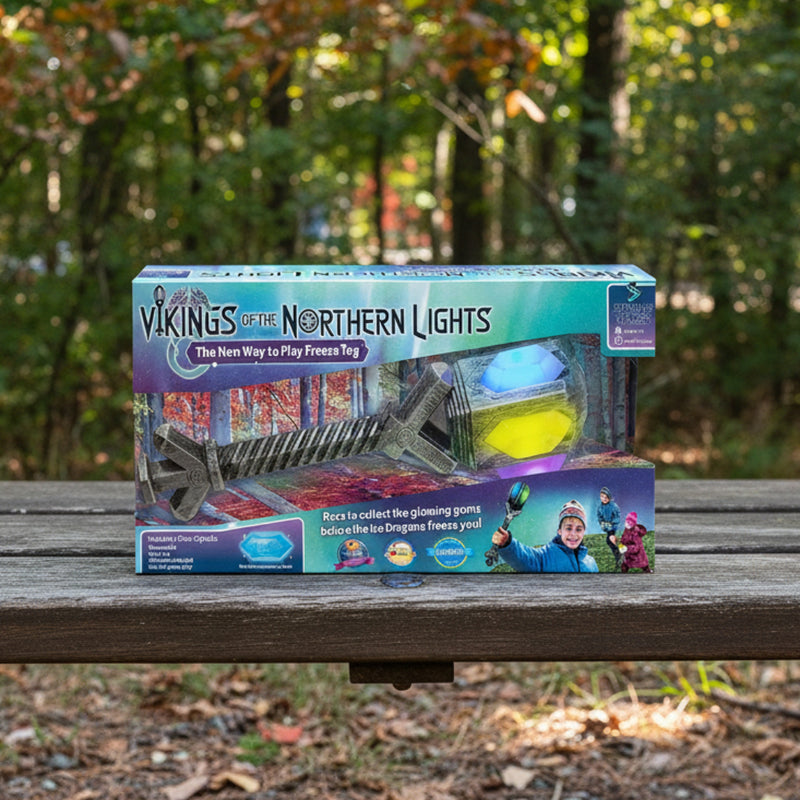 Box of 'Vikings of the Northern Lights' game with toy sword and glowing ball on a white background