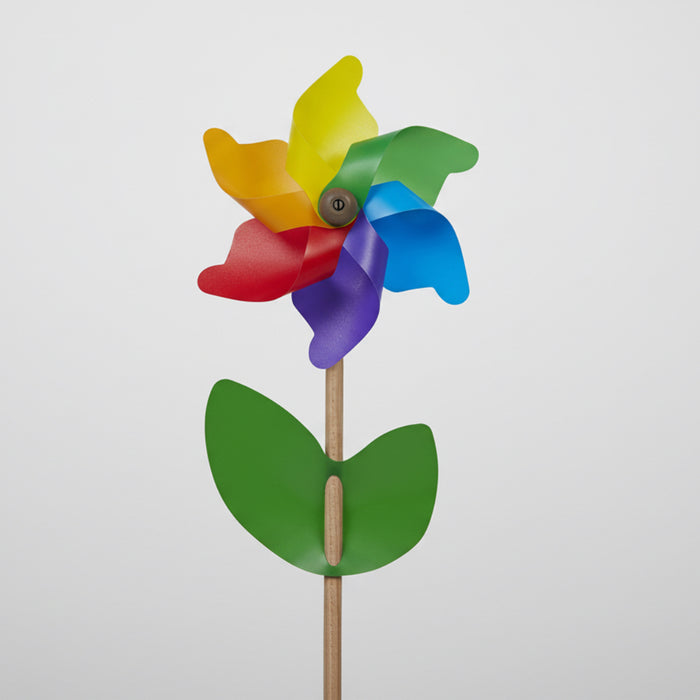 Colorful pinwheel with a green base on a white background