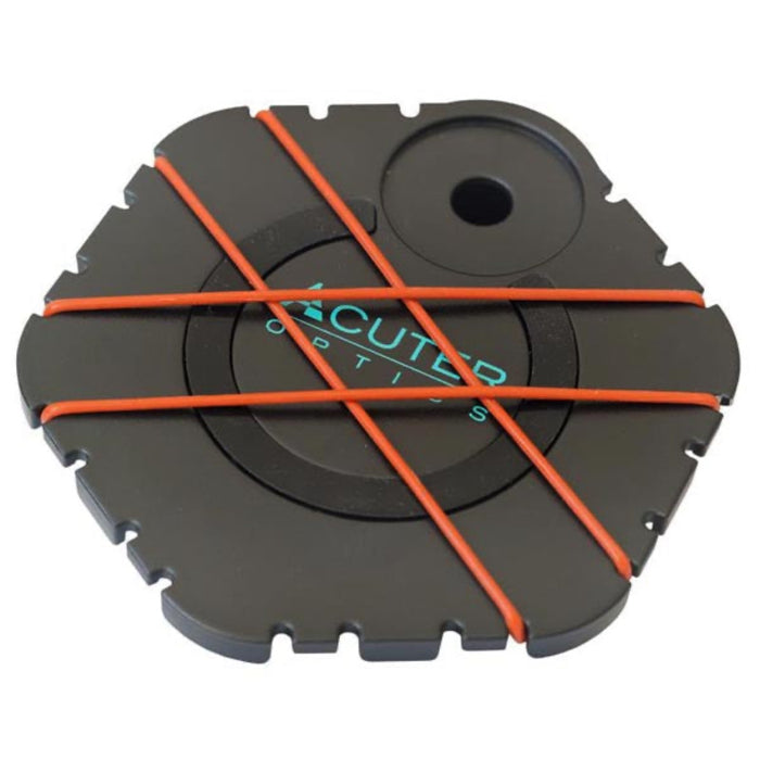 Black circular tool with orange bandage on a white background