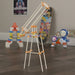 Toy construction set on a wooden floor with colorful toys in the background