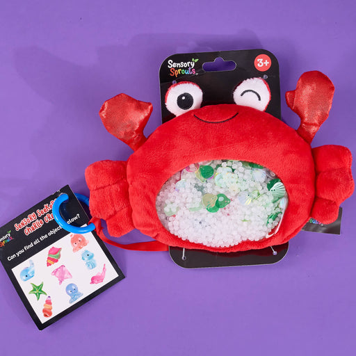 Charlie Crab, a sensory toy on a purple bacground
