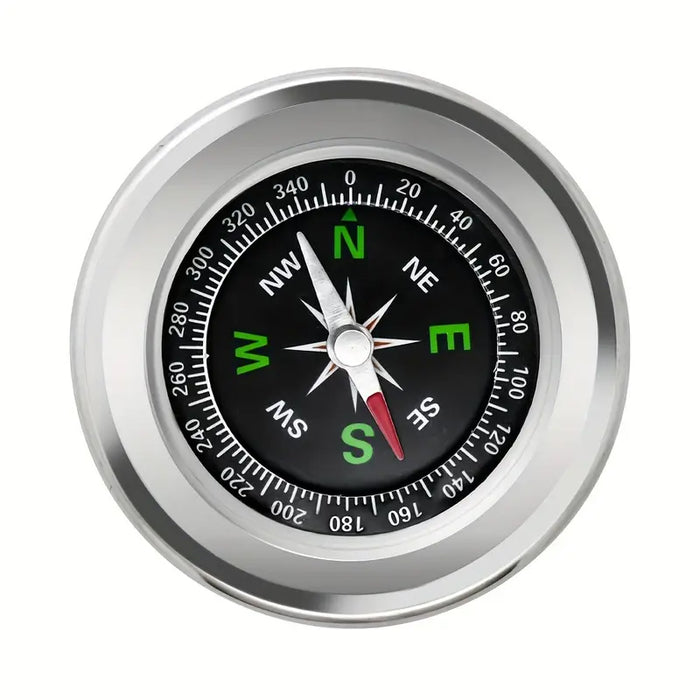 Compass with silver rim and black dial on a white background Compass with silver frame and black dial on a white background