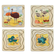 A children's wooden animal puzzle set with a partially assembled bird puzzle board on the right and several loose puzzle pieces on the left, photographed on a plain white background.