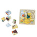 A children's wooden animal puzzle set with a partially assembled bird puzzle board on the right and several loose puzzle pieces on the left, photographed on a plain white background.