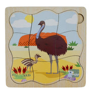 A wooden children's puzzle board featuring an illustrated emu and chick in a desert landscape, with a light natural wood border and a round peg hole in the top right.