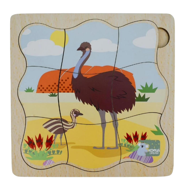 A wooden children's puzzle board featuring an illustrated emu and chick in a desert landscape, with a light natural wood border and a round peg hole in the top right.