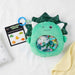 Sensory Seekers Danny Dino tactile exploration toy on a babe bed