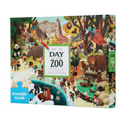 Crocodile Creek 'Day at the Zoo' 60-piece jigsaw puzzle box, featuring a colorful, busy cartoon illustration of various animals and children at the zoo.