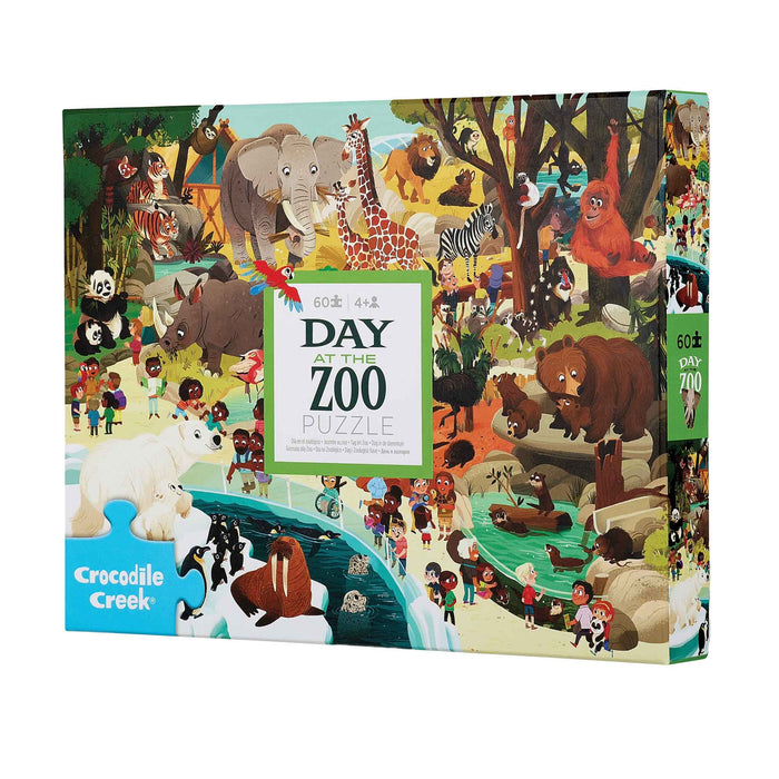 Crocodile Creek 'Day at the Zoo' 60-piece jigsaw puzzle box, featuring a colorful, busy cartoon illustration of various animals and children at the zoo.