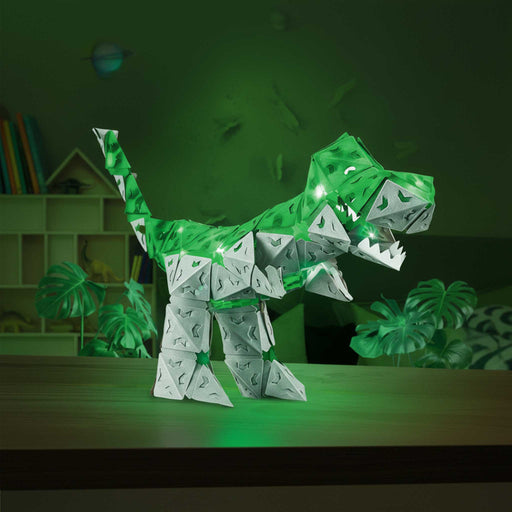 CREATTO dinosaur toy set packaging  Toy dinosaur model with glowing green lights on a table