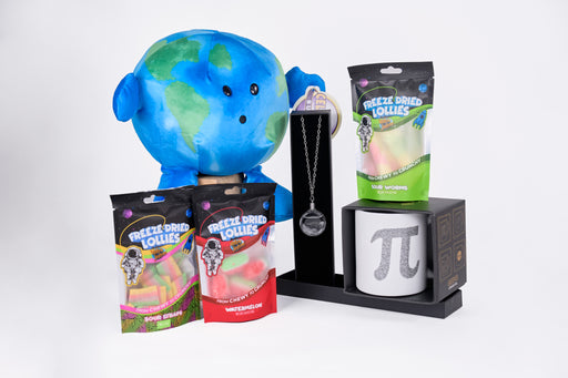 Curated photo of toys which includes celestial buddies earth, freeze dried lollies, fitzroy's storm glas necklace, and a pi mug