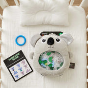 Sensory Seekers Kiki Koala is a tactile on a baby bed