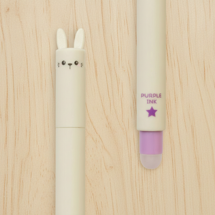 Pen with rabbit design and purple ink cap on a white background