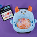 Monty Monster is a tactile wonder baby toy on a purple background