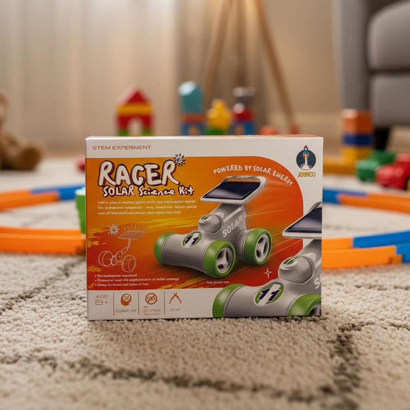 A boxed STEM experiment kit labeled 'Racer Solar Science Kit' standing on a beige carpet in a living room. The box shows a solar-powered toy racer with gray body and green wheels, and the brand name 'SOLILY' is visible on the top right.