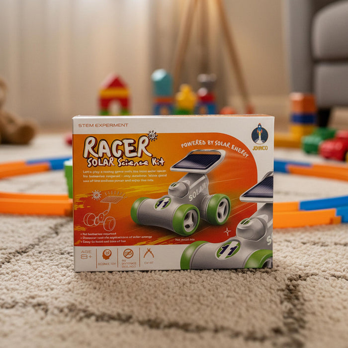 A boxed STEM experiment kit labeled 'Racer Solar Science Kit' standing on a beige carpet in a living room. The box shows a solar-powered toy racer with gray body and green wheels, and the brand name 'SOLILY' is visible on the top right.