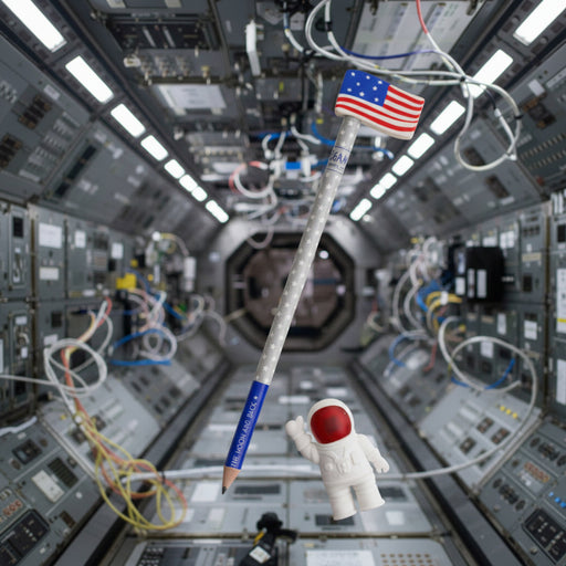 Astronaut figure inside a space shuttle with an American flag on a pencil