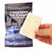 Freeze-dried ice cream bar held in front of its packaging