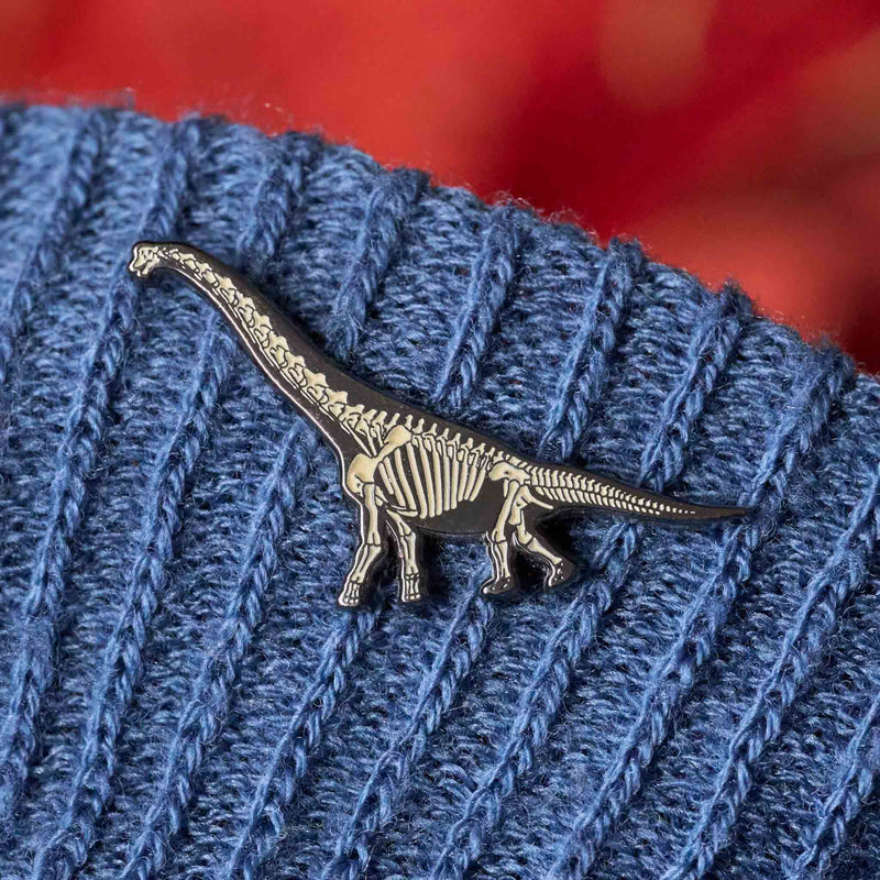 brachiosaurus glowing dinosaur skeleton enamel pin on jumper 